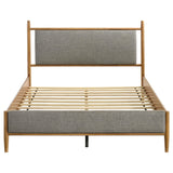 Light brown wood frame detail on Mason queen panel platform bed