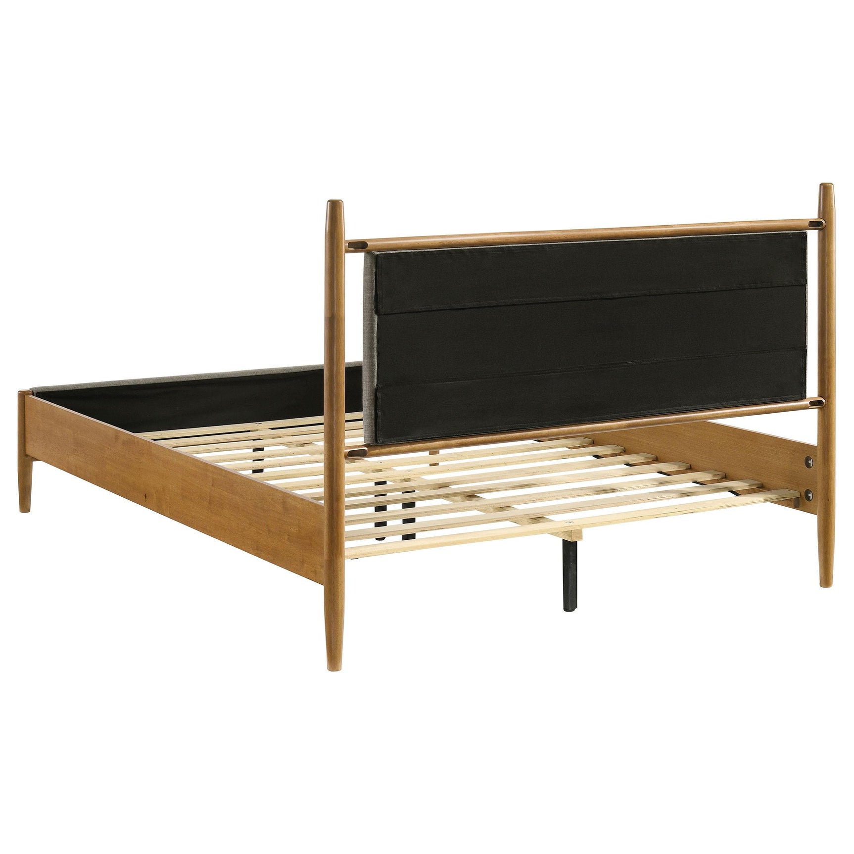 View of bed footboard and side rails in light brown wood