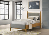 Mason platform bed headboard close-up with grey upholstery