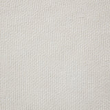 Cream upholstered bed in styled bedroom setting