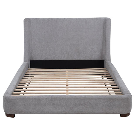 Detail of walnut-toned rubberwood legs on Rennes bed