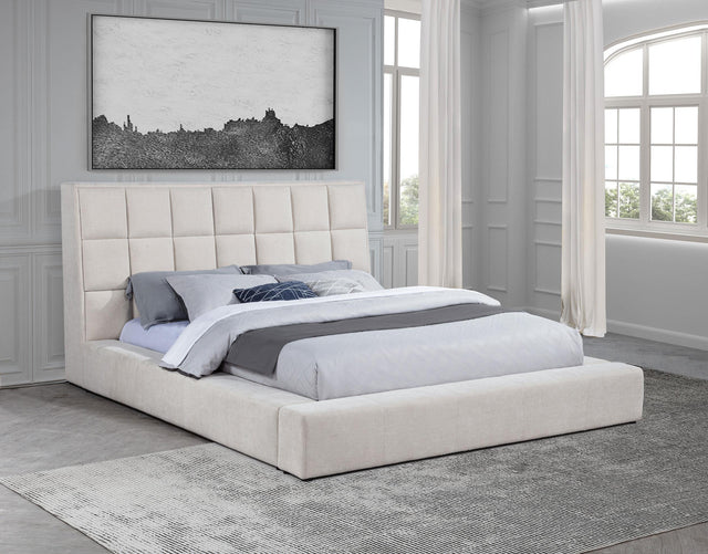 Side view of Dreux Eastern King Upholstered Bed showing wide side rails