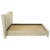 Evelyn bed corner showing gold leg and upholstery