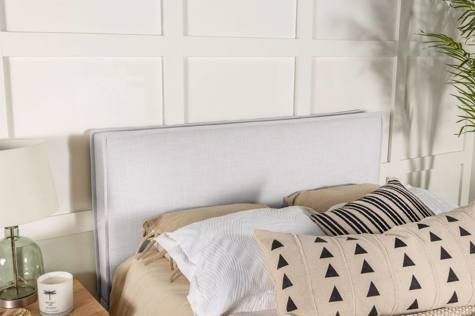 Close-up of Izzy headboard sand fabric and tufting
