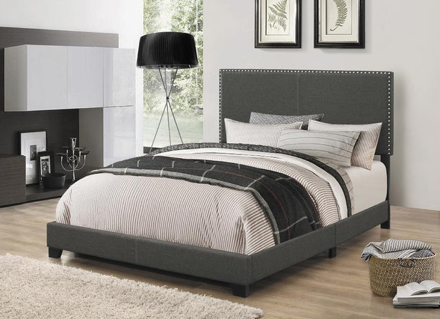 Boyd full size upholstered bed in charcoal with nailhead trim, front view