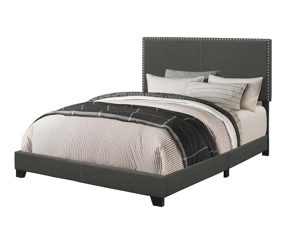 Boyd full size upholstered bed in charcoal with nailhead trim, side angle