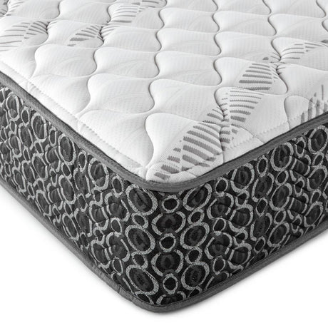Close-up of quilted tight top firm foam layer on Hayes hybrid mattress