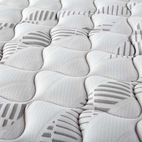 Angled view of Hayes Queen Firm Tight Top Hybrid Mattress showcasing mattress thickness and firmness