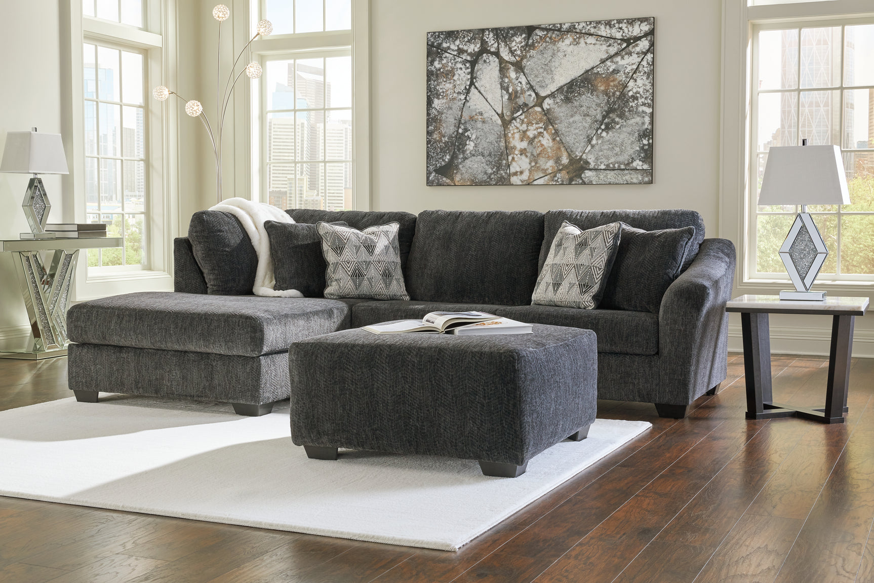 Room setting featuring 2-piece sectional and ottoman