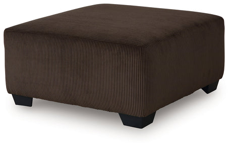 Kimlee oversized ottoman head-on view showing chocolate velvet upholstery