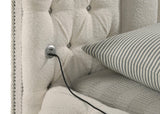 Rounded headboard shape in ivory upholstery