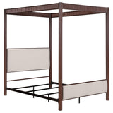 Zimmerlee canopy bed side angle showing metal frame and fabric upholstery