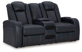 Close-up of cup holders and charging ports on sofa arm