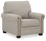Gaelon chair side angle showing bun legs and upholstery