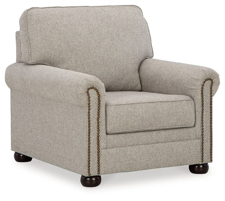 Gaelon chair side angle showing bun legs and upholstery