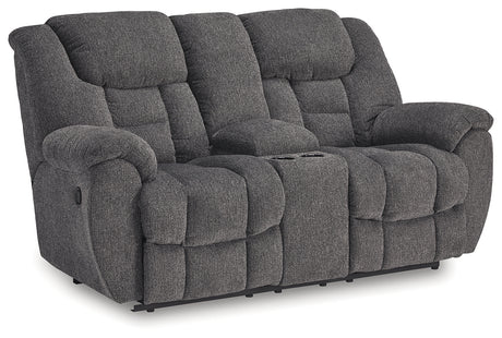 Close-up of Foreside loveseat console with cup holders and storage open
