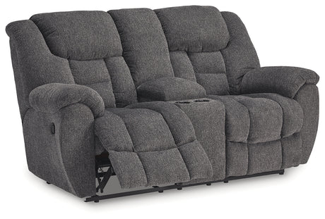 Side angle of Foreside reclining loveseat showing armrest and footrest
