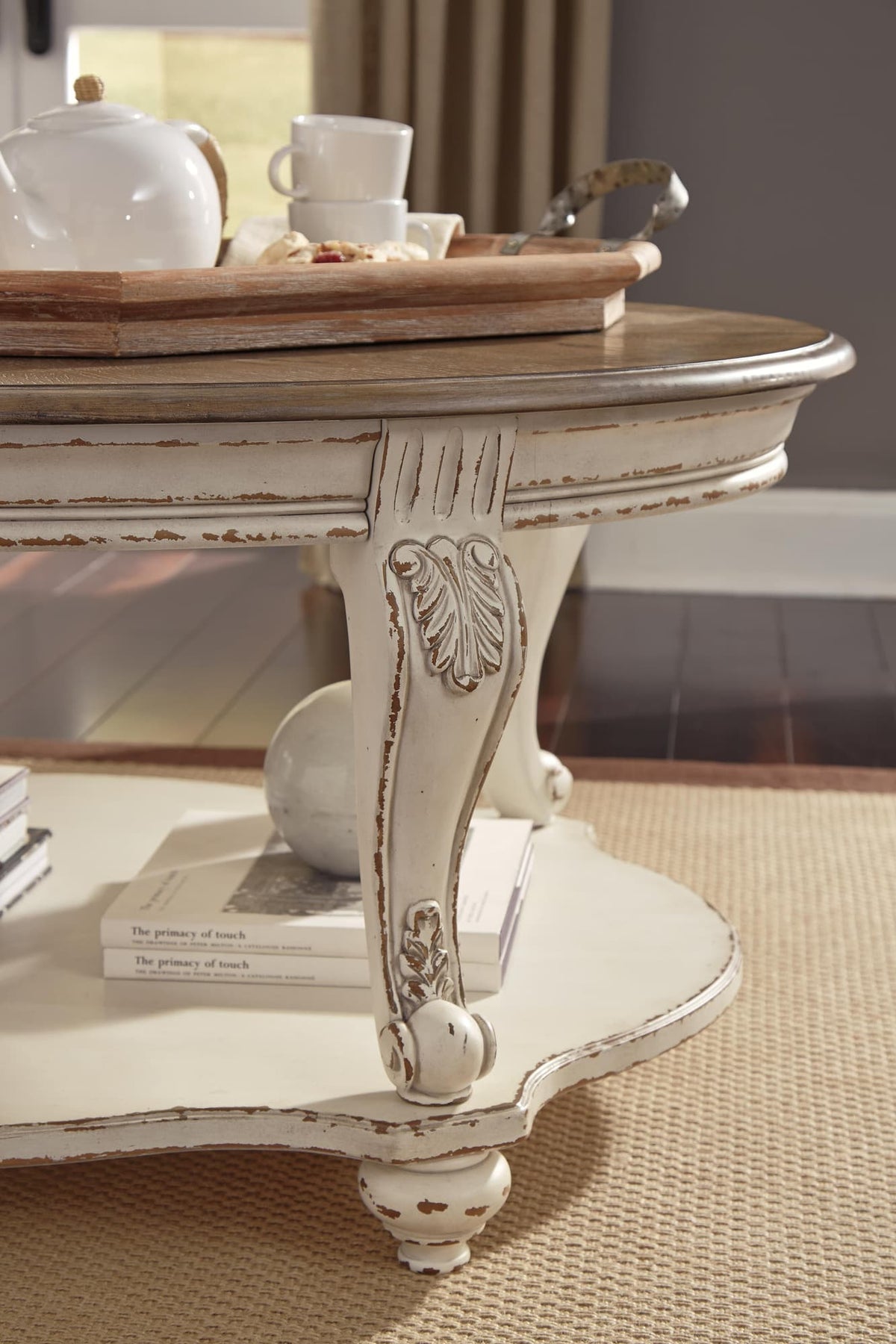Realyn White/Brown Coffee Table with 2 End Tables — detail view