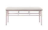 Close-up of tufted powder pink fabric upholstery on bench