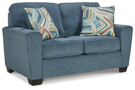 Angled side view of Cashton Blue armchair