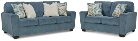 Side view of Cashton blue sofa and loveseat