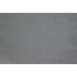 Grazioso dark gray velvet tufted accent chair in room setting