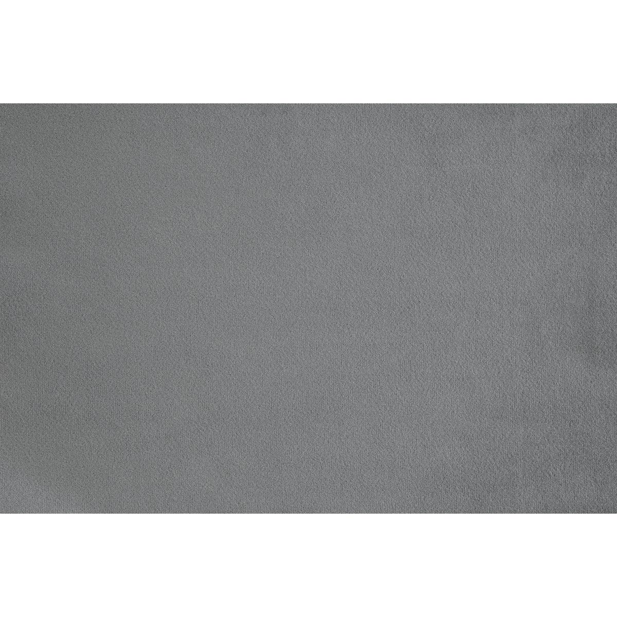Grazioso dark gray velvet tufted accent chair in room setting