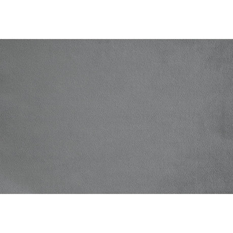 Grazioso dark gray velvet tufted accent chair in room setting