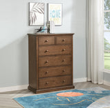 Side angle of Sumerlin bedroom chest showing drawer detail