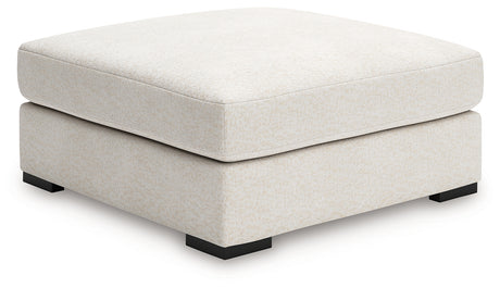 Donelson Creek Ottoman side profile showcasing upholstery and leg detail