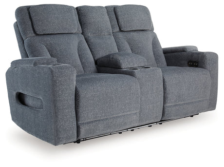 Console with cup holders and hidden storage in Studio Cave reclining loveseat