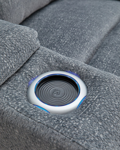 Studio Cave steel-colored power reclining loveseat with console in chenille fabric front view reclining