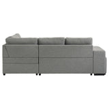 Roanne grey fabric upholstered sleeper sectional sofa angled view with chaise