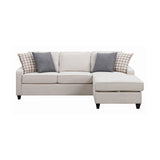 Detail view of cream fabric upholstery on sectional sofa