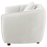 Close-up of ivory chenille upholstery and rounded arms on the Aleisha chair
