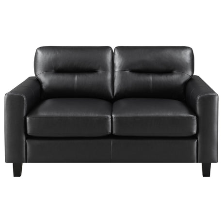 Close-up of black leatherette upholstery and track arm