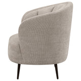Detail of tapered black powder-coated metal legs on Ellorie chair