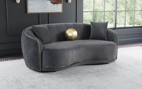 Side view of Brookside dark grey velvet curved upholstered sofa