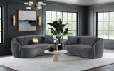 Side perspective of velvet upholstered sofa in dark grey
