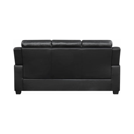 Finley black tufted upholstered sofa angled front view