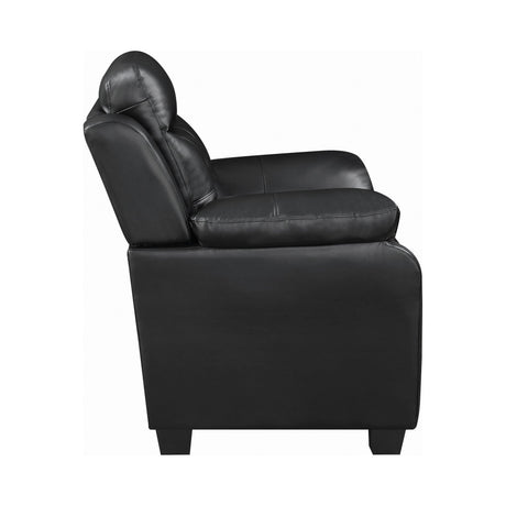 Finley black tufted upholstered sofa angled side view