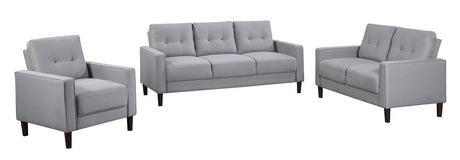 Grey upholstered tufted loveseat with track arms, front view
