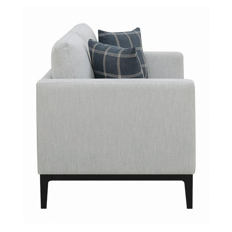 Side view of Apperson light grey loveseat with plaid pillows