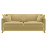 Close-up detail of the camel velvet upholstery on Corliss sofa