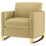 Detail of gold stainless steel legs with plastic glides on Corliss chair
