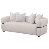 Close-up of Jeanette sofa beige fabric upholstery and rounded arm