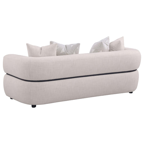 Side angle of Jeanette beige fabric sofa