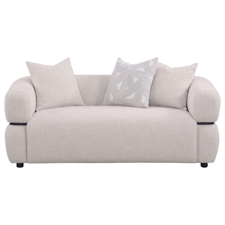 Jeanette loveseat side angle showing curved frame and wood waistband