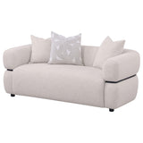 Close-up of upholstery texture and accent pillows on Jeanette loveseat