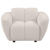 Side angle of Destino chenille accent chair showing tufted upholstery and wooden legs
